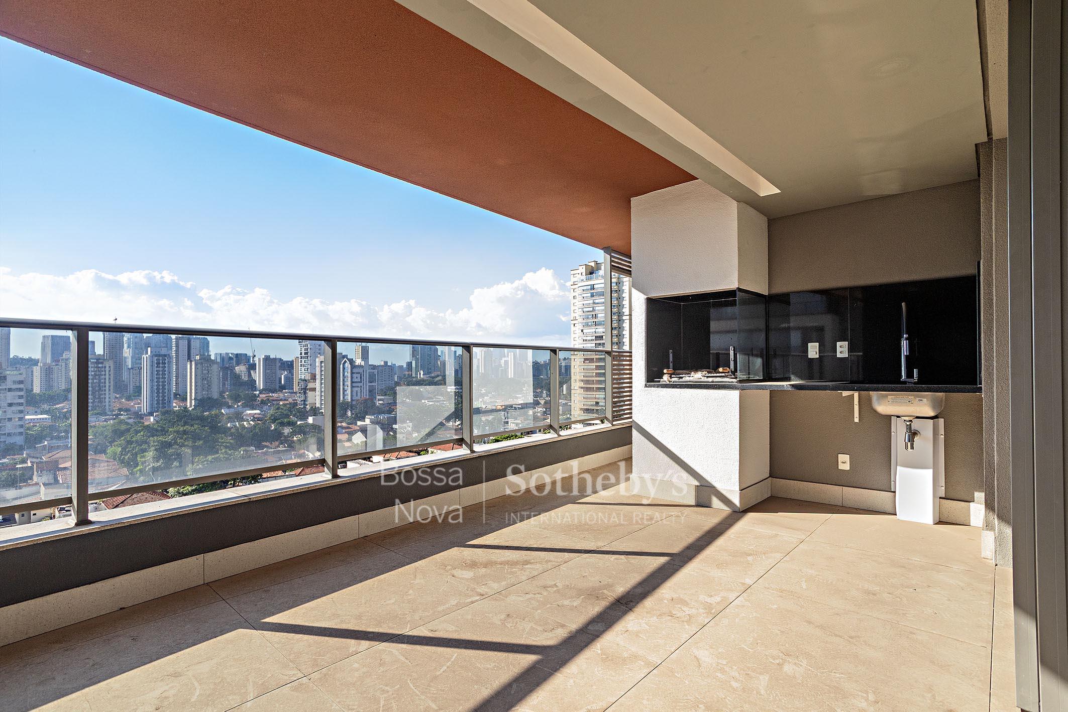 Varanda gourmet e vista para o verde em condomínio moderno
